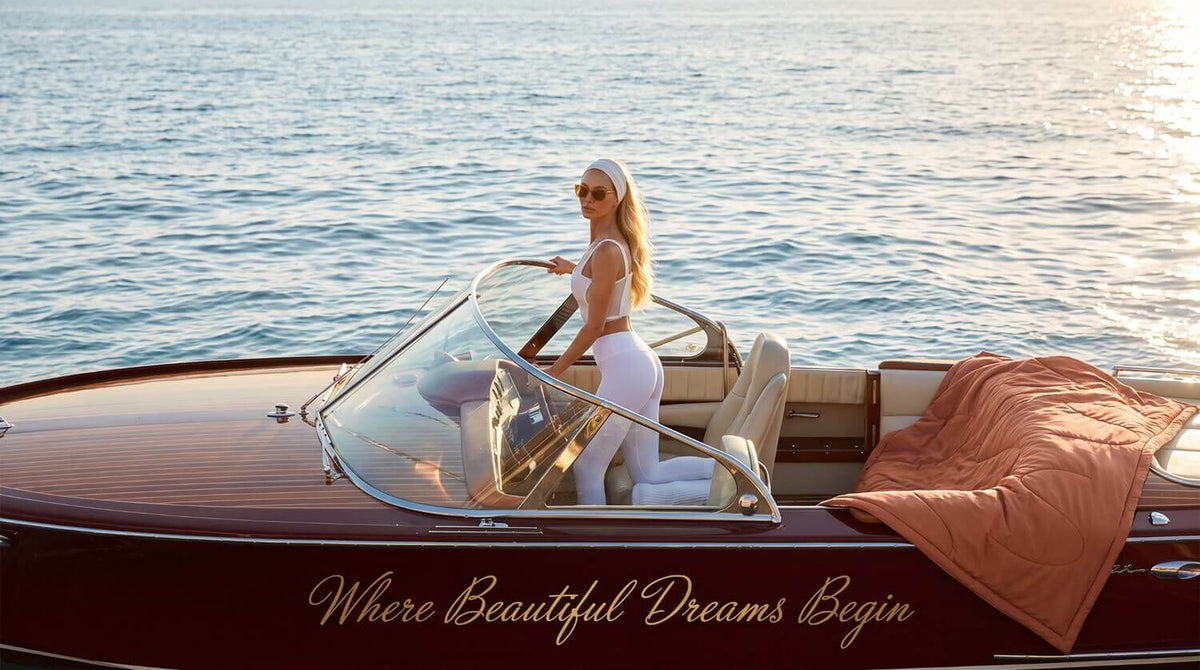 woman travelling in a boat with sovenestia comforter for a beautiful life